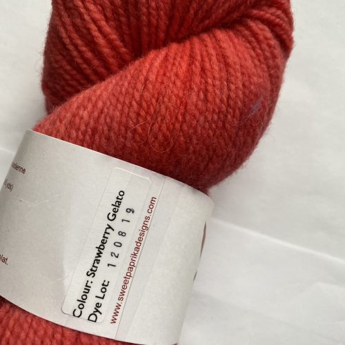 One skein of red-orange yarn.