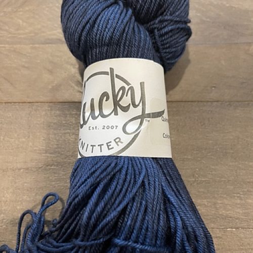 A skein of dark blue yarn.